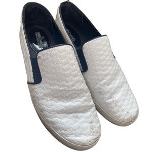 Michael Kors logo stamped white slip on shoes
